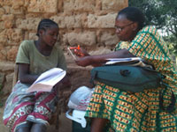 Study nurse explaining the study procedures self-administered vaginal swab taken for HPV incidence study in Mwanza, Tanzania